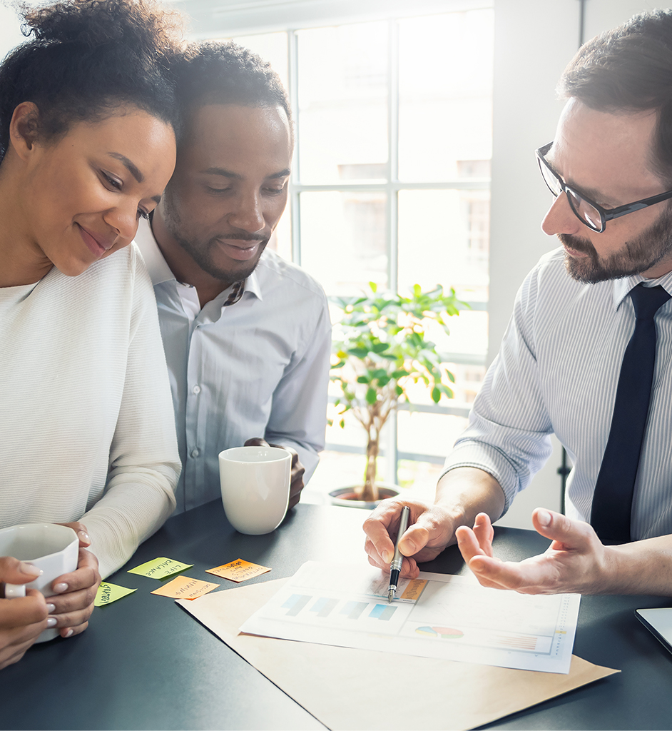 A Group of People Discussing And Evaluating Mortgage Options